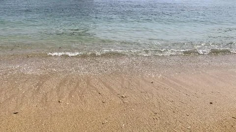 Small tiny waves lapped at the shore. Kondang Merak Beach in Malang Indonesia Stock Photos