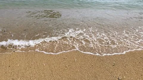 Small tiny waves lapped at the shore. Kondang Merak Beach in Malang Indonesia Stock Photos