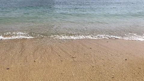 Small tiny waves lapped at the shore. Kondang Merak Beach in Malang Indonesia Stock Photos