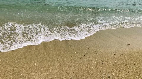 Small tiny waves lapped at the shore. Kondang Merak Beach in Malang Indonesia 스톡 사진