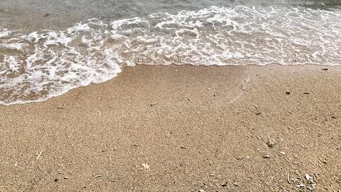 Small tiny waves lapped at the shore. Kondang Merak Beach in Malang Indonesia 스톡 사진