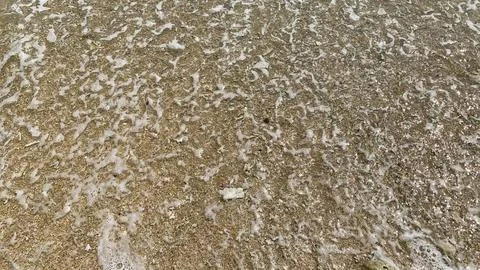 Small tiny waves lapped at the shore. Kondang Merak Beach in Malang Indonesia Stock Photos