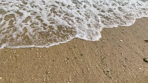 Small tiny waves lapped at the shore. Kondang Merak Beach in Malang Indonesia 스톡 사진