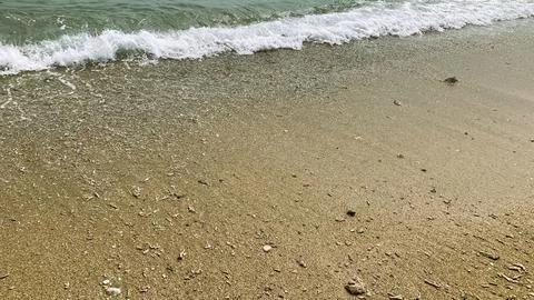 Small tiny waves lapped at the shore. Kondang Merak Beach in Malang Indonesia 스톡 사진