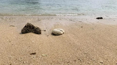 Small tiny waves lapped at the shore. Kondang Merak Beach in Malang Indonesia Stock Photos