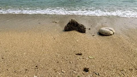 Small tiny waves lapped at the shore. Kondang Merak Beach in Malang Indonesia Stock Photos