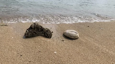 Small tiny waves lapped at the shore. Kondang Merak Beach in Malang Indonesia Stock Photos