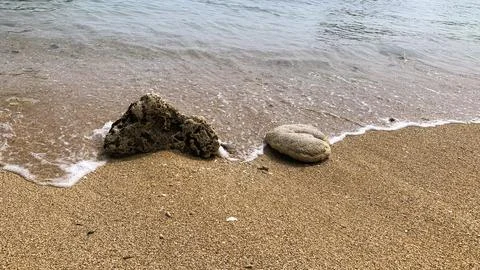 Small tiny waves lapped at the shore. Kondang Merak Beach in Malang Indonesia Stock Photos