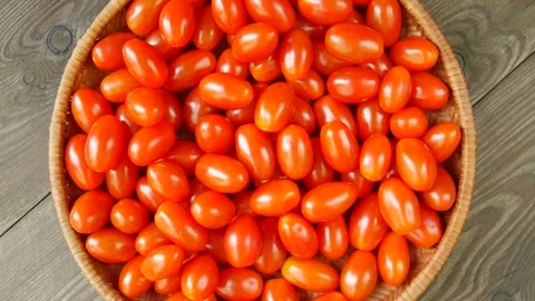 Small tomatoes in a basket. Stock Footage 297299395