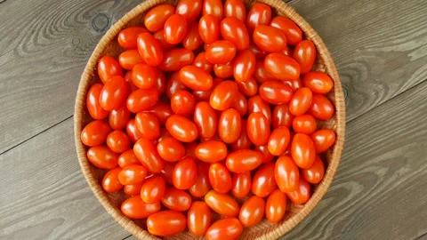 Small tomatoes in a basket. 스톡 동영상 301860976