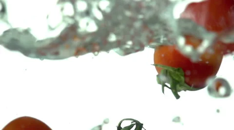 Small Tomatoes Falling Into Water Video stock 46108777