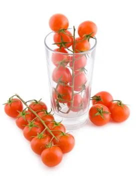 Small tomatoes in a glass Stock Photos
