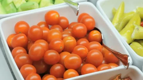 Small tomatoes, peppers, pickles at restaurant display Stock Footage 10735102