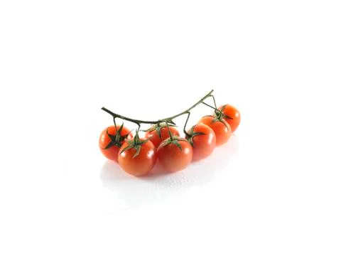 Small tomatoes on a white background Stock Photos