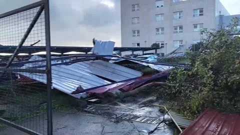 A small tornado, accompanied by hail, causes significant material damage in Plas Stock Footage 327928427