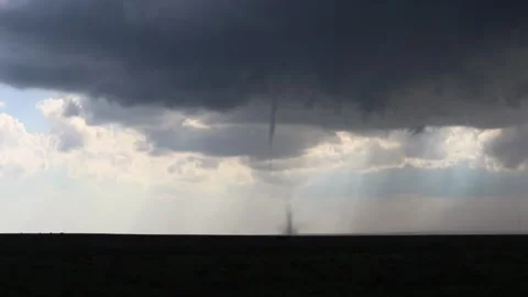 Small tornado stirs dust on plains Stock Footage 244010630