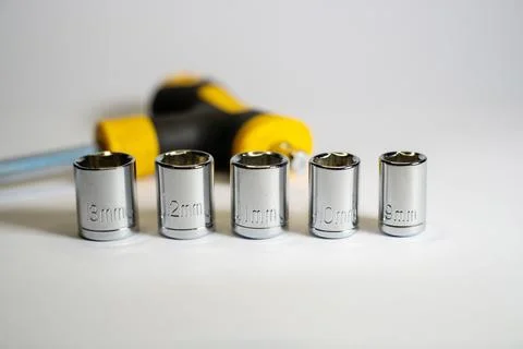 Small torque wrench with hex socket sizes 9mm, 10mm, 11mm, 12mm and 13mm Stock Photos