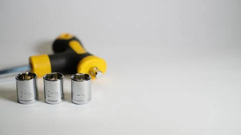 Small torque wrench with hex socket sizes 11mm, 12mm and 13mm Stock Photos