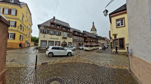 Small Tourist Train Driving Through Historic Town Square Видео 344571436