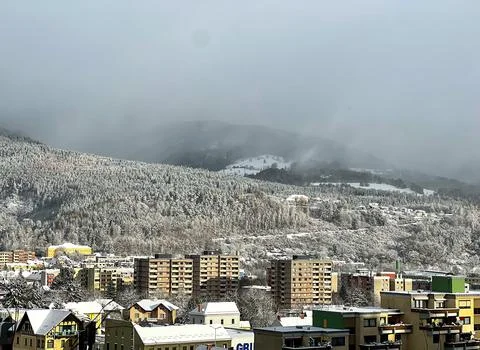 Small town against the backdrop of the Alpine mountains Stock Photos