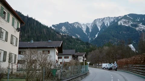 Small town in the alps in Austria with typical alpine style buildings and houses Stock Footage 261763907