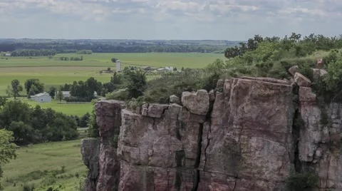Small Town and Clouds Billowing Over Cliffside Video stock 67751707
