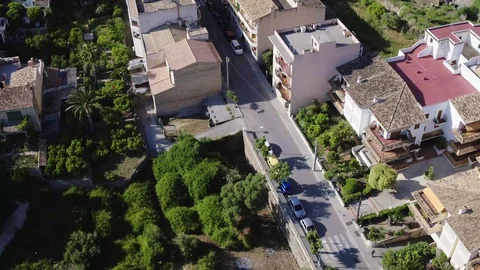 Small town and green hills aerial view, Mallorca island, color-corrected, 4k. Stock Footage 90162653