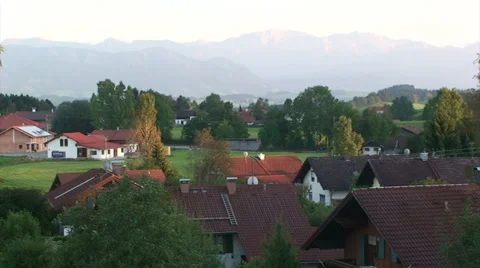 Small town in Bavaria with Alps in the background Stock Footage 33477364
