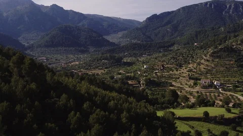 Small town between forest and hills, aerial shot, Mallorca island, raw in 4k. Stock Footage