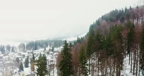 A small town with cottage development at the foot of a hill in winter Stock Footage 170696140