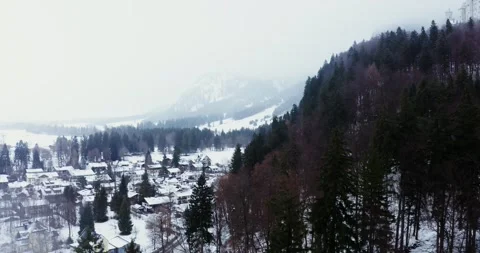 A small town with cottage development at the foot of a hill in winter Stock Footage 170696706