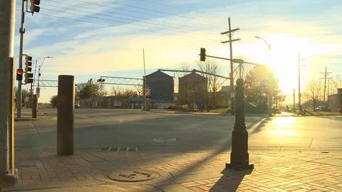 Small town evening traffic grain bins Stock Footage 100048461