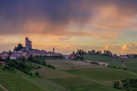 Small town on the hill under cloudy sky in italy. Stock Photos