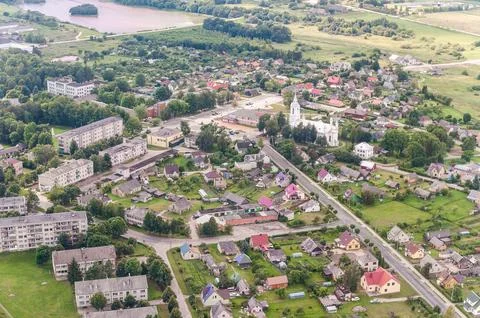 Small Town In Lithuania with lake in background. View of Bird. Stock Photos