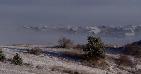 Small town in mountains covered with clouds Stock Footage 147661068