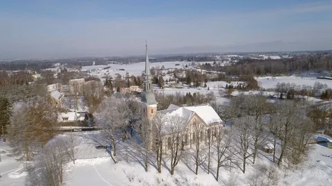 Small town neo-Gothic style Protestant church during snowy winter Stock Footage 88745150
