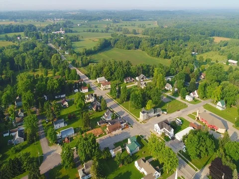 Small town nestled amid fertile valley in beautiful rural Wisconsin Stock Footage