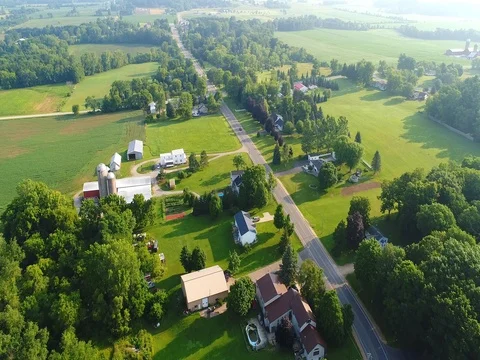 Small town nestled amid fertile valley in beautiful rural Wisconsin Stock Footage