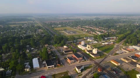 Small town with old grain elevator along train tracks in Carleton, Stock Footage 285871110