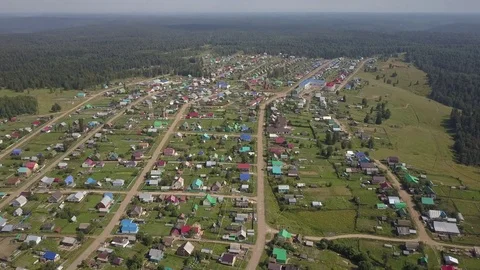 Small town on a plateau in the middle of the forest aerial Video stock 78505401