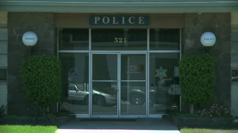 Small Town Police Station glass doors Stock Footage