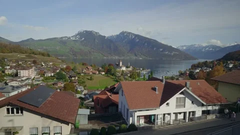 A small town with a river and mountains in the background Video stock 313398413