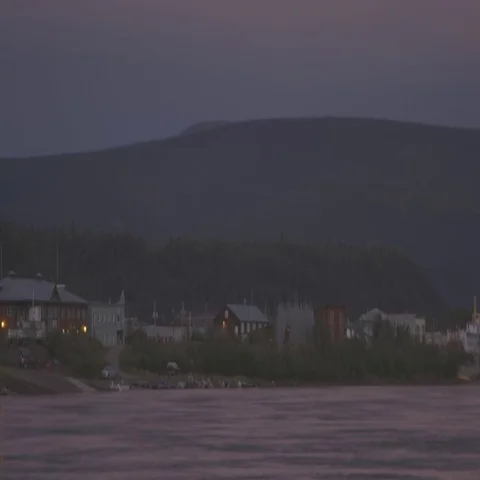 A small town at a river with hills in the background. Stock Footage 69289344