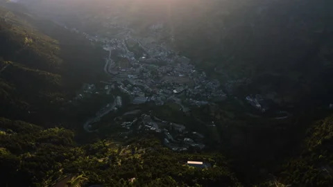 Small town in the shadow of Pyrenees mountains during sunset, Encam, Andorra 스톡 동영상 139493710
