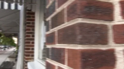Small town sidewalk - pan left Stock Footage 96035664