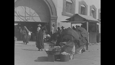 Small town, soldiers marching through, maybe in Mexico Stock Footage 252494512