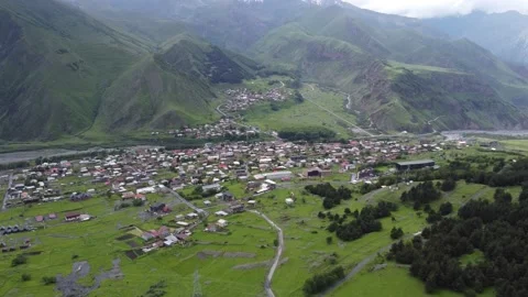 A small town Stepantsminda and a Mount Kazbek (Kazbegi) Stock Footage 199390245