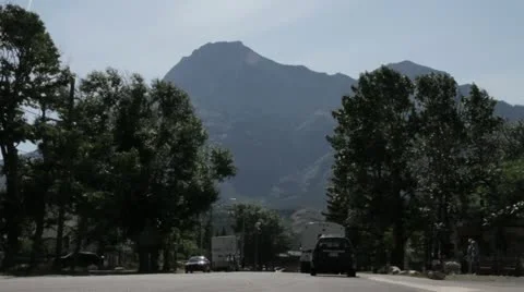 Small Town Street with Mountain Background Stock Footage 22018501