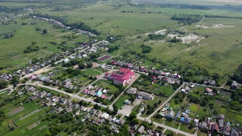 Small town in the suburbs as captured by a drone Stock Footage 234390818
