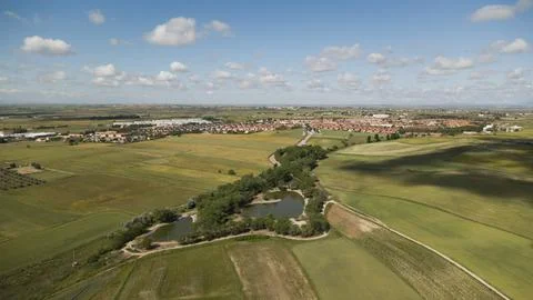 Small town surrounded by fields and ponds, seen from above Stock Photos
